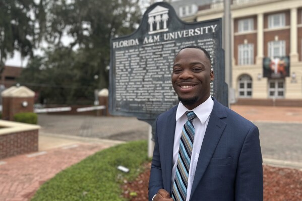 Jovan Mickens, a political science major at Florida AM University, poses for a photo before class on Sept. 27, 2023 in Tallahassee, Fla. A core mission of Florida A&M University from its founding over a century ago has been to educate African Americans. It was written into the law that established the school along with another college, in Gainesville, reserved for white students. At Florida's only public HBCU, some students now fear political constraints might get in the way of teaching parts of their history. (AP Photo/Sharon Johnson)