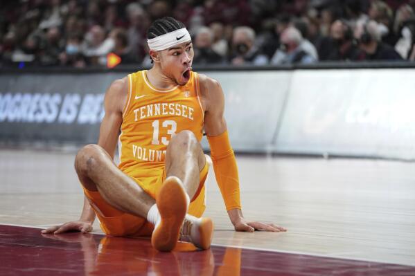 Tennessee forward Olivier Nkamhoua reacts to an injury in the second half of an NCAA college basketball game against South Carolina, Saturday, Feb. 5, 2022, in Columbia, S.C. Tennessee won 81-57. (AP Photo/Sean Rayford)