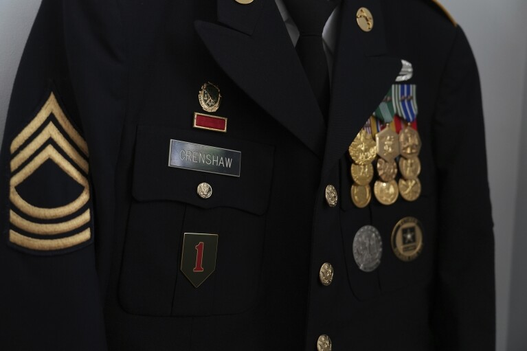 Dave Crenshaw's army service dress jacket hangs in his home in Kearny, N.J., on Monday, June 3, 2024. (AP Photo/Mary Conlon)