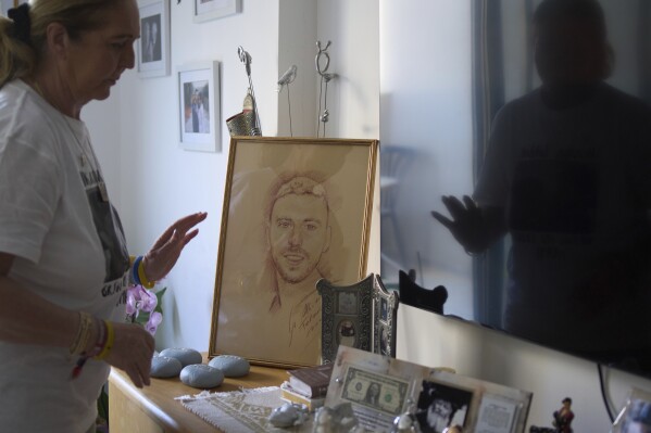 Ruhama Bohbot, mother of hostage Elkana Bohbot, has a picture of her son on display at her home in Mevaseret Zion, Israel, Wednesday, May 7, 2025. (AP Photo/Maya Alleruzzo)