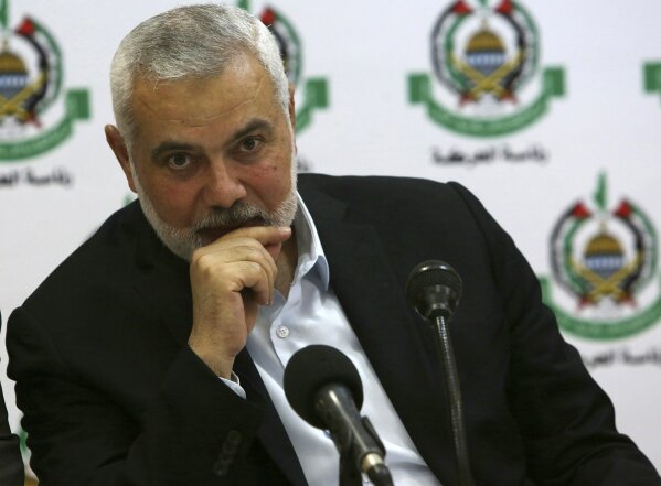 Hamas' chief Ismail Haniyeh attends a meeting with foreign reporters at al-Mat'haf hotel in Gaza City, Thursday, June 20, 2019. Hamas' chief says Israel is ignoring the terms of an indirect cease-fire agreement for the Gaza Strip. (AP Photo/Adel Hana)