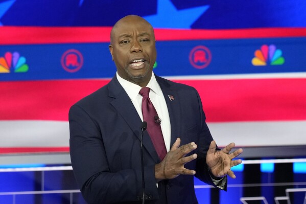 FILE - Sen. Tim Scott, R-S.C., speaks during a Republican presidential primary debate, Nov. 8, 2023, in Miami. Scott, a 2024 vice presidential contender for GOP frontrunner former President Donald Trump's ticket, is treading carefully on questions about whether he would have certified the 2020 election if he had been vice president at the time. Scott in a pair of Sunday, Feb. 18, television interviews, would not say if he would have acted differently than Vice President Mike Pence. (APPhoto/Rebecca Blackwell, File)