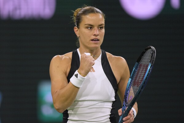 Maria Sakkari, of Greece, reacts after winning a set against Coco Gauff, of the United States, during a semifinal at the BNP Paribas Open tennis tournament in Indian Wells, Calif., Friday, March 15, 2024. (AP Photo/Ryan Sun)