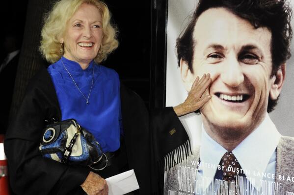FILE - Eileen Ryan, mother of actor Sean Penn, touches her son's image on the poster at the premiere of "Milk" in Beverly Hills, Calif., on Nov. 13, 2008.  (AP Photo/Chris Pizzello, File)