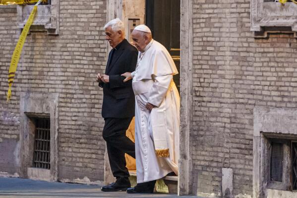 FILE - Pope Francis is flanked by Jesuits' superior general Arturo Sosa Abascal, left as he leaves the Church of the Gesu', mother church of the Society of Jesus (Jesuits), after presiding a mass on March 12, 2022. The head of Pope Francis’ Jesuit religious order admitted Wednesday, Dec. 14, 2022, that a famous Jesuit priest had been convicted of one of the most serious crimes in the Catholic Church some two years before the Vatican decided to shelve another case against him for allegedly abusing other adult women under his spiritual care.The Rev. Arturo Sosa, the Jesuit superior general, made the admission during a briefing with journalists that was dominated by the scandal over the Rev. Marko Ivan Rubnik and the reluctance of both the Vatican and the Jesuits to tell the whole story behind the unusually lenient treatment he received. (AP Photo/Domenico Stinellis)