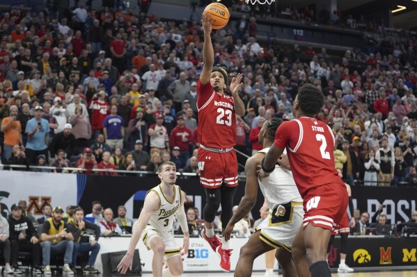 Wisconsin guard Chucky Hepburn (23) shoots and scores a shot to force overtime during the second half of an NCAA college basketball game against Purdue in the semifinal round of the Big Ten Conference tournament, Saturday, March 16, 2024, in Minneapolis. (AP Photo/Abbie Parr)