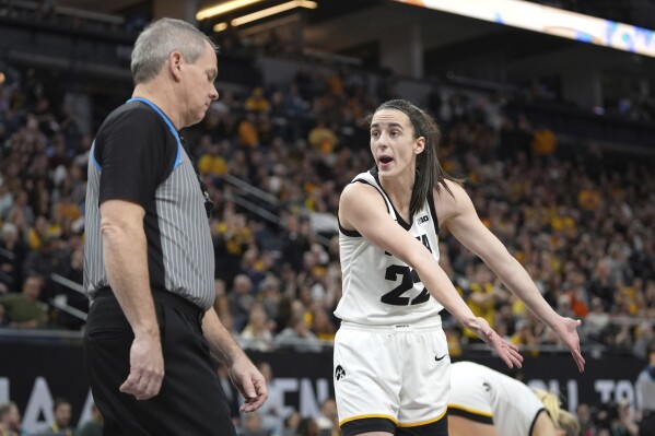 Iowa guard Caitlin Clark (22) gestures toward a referee during the first half of an NCAA college basketball game against Nebraska in the final of the Big Ten women's tournament Sunday, March 10, 2024, in Minneapolis. (AP Photo/Abbie Parr)