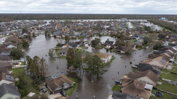 FILE - Flooded streets and homes are shown in the Spring Meadow subdivision in LaPlace, La., after Hurricane Ida moved through, Aug. 30, 2021. Hurricanes beginning with the letter "I" have been among the most destructive to strike the United States, moreso than any other letter of the alphabet. Idalia is on a path to strike Florida's Gulf Coast as a major hurricane to join the long list of catastrophic examples.(AP Photo/Steve Helber, File)