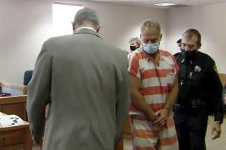 FILE - In this May 6, 2021 still file image from video, Barry Morphew, center, appears in court in Salida, Colo. An arrest warrant affidavit for Morphew, charged with murder in the death of his wife who disappeared last year will remain sealed, a judge ruled Friday, June 4, 2021, arguing that release of the document could harm the couple's daughters and witnesses in the case and hinder Morphew's ability to prepare his defense. (KUSA via AP, Pool,File)