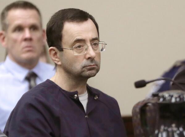 FILE - In this Jan. 24, 2018, file photo, Larry Nassar, a former doctor for USA Gymnastics and member of Michigan State's sports medicine staff, sits in court during his sentencing hearing in Lansing, Mich. The FBI made numerous serious errors in investigating allegations against former USA Gymnastics national team doctor Larry Nassar and didn't treat the case with the “utmost seriousness,” the Justice Department's inspector general said Wednesday, July 24, 2021. The FBI acknowledged conduct that was “inexcusable and a discredit" to America's premier law enforcement agency. (AP Photo/Carlos Osorio, File)