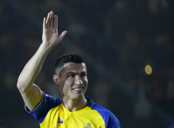 Cristiano Ronaldo greets Saudi fans during his official unveiling as a new member of Al Nassr soccer club in in Riyadh, Saudi Arabia, Tuesday, Jan. 3, 2023. Ronaldo, who has won five Ballon d'Ors awards for the best soccer player in the world and five Champions League titles, will play outside of Europe for the first time in his storied career. (AP Photo/Amr Nabil)
