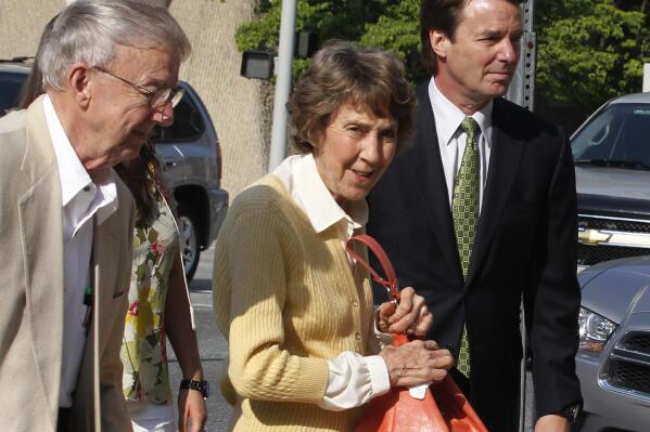 Former Sen. John  Edwards, right, leads his mother Bobbie Edwards, center, and father Wallace Edwards, into the Federal Courthouse in Greensboro, N.C. Wednesday, May 2, 2012.  Edwards is accused of conspiring to secretly obtain more than $900,000 from two wealthy supporters to hide his extramarital affair with Rielle Hunter and her pregnancy from the media. He has pleaded not guilty to six charges related to violations of campaign-finance laws.  (AP Photo/The News & Observer, Chuck Liddy)