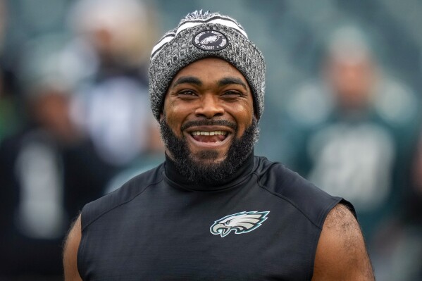 FILE - Philadelphia Eagles defensive end Brandon Graham smiles during warm ups before an NFL football game against the New York Giants Monday, Dec. 25, 2023, in Philadelphia. The Eagles agreed to terms on a one-year contract with Graham, the team announced Saturday, March 9, 2024. (AP Photo/Matt Slocum, File)