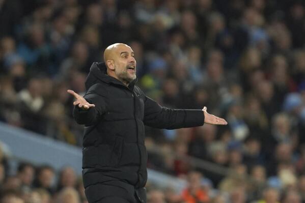 Manchester City's head coach Pep Guardiola reacts during the English Premier League soccer match between Manchester City and Leeds United at Etihad stadium in Manchester, England, Tuesday, Dec. 14, 2021. (AP Photo/Jon Super)