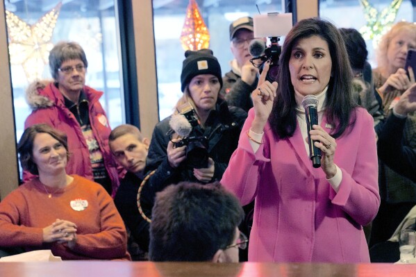 FILE - Republican presidential hopeful Nikki Haley speaks with supporters Jan. 15, 2024, in Des Moines, Iowa. Even without Donald Trump on Nevada’s Republican ballot, Nikki Haley was still denied her first victory. The indignity of a distant second-place finish behind “none of these candidates” was a blow for Haley facilitated by the staunch Trump allies who lead Nevada’s GOP. They had already maneuvered to ensure Trump has a lock on the state’s 26 delegates, who will be awarded in caucuses on Thursday where he faces only token opposition. (AP Photo/Meg Kinnard, File)