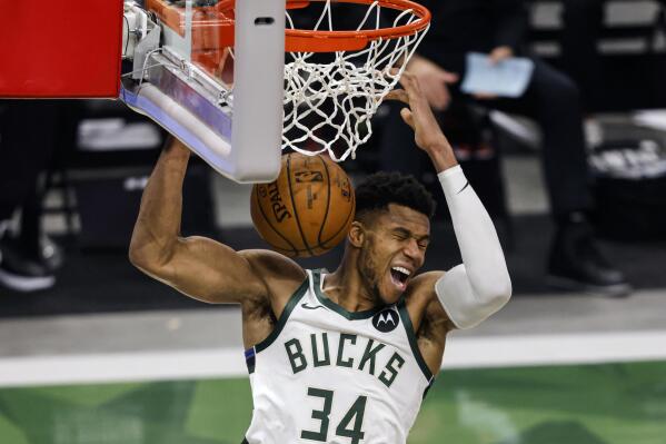 Milwaukee Bucks forward Giannis Antetokounmpo (34) dunks the ball against the Miami Heat during the second half of Game 2 of their NBA basketball first-round playoff series Monday, May 24, 2021, in Milwaukee. (AP Photo/Jeffrey Phelps)