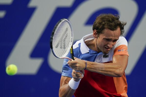Daniil Medvedev of Russia returns a ball during a match against to Pablo Andujar of Spain at the Mexican Open tennis tournament in Acapulco, Mexico, Wednesday, Feb. 23, 2022. (AP Photo/Eduardo Verdugo)