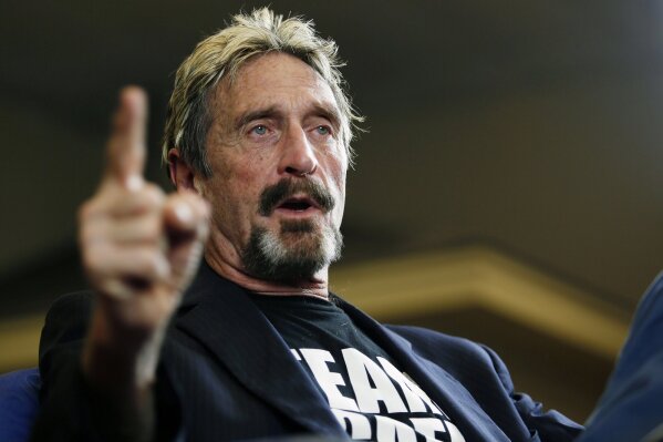 
              FILE - In this Sept. 9, 2015 file photo, internet security pioneer John McAfee announces his candidacy for president in Opelika, Ala. McAfee became involved with a defunct operation called the Round House started by Kyle Sandler in Opelika. He briefly ran for president with the business incubator as his headquarters and Sandler as an adviser in 2016. Sandler has since pleaded guilty to federal charges in an investment scam that involved the Round House. (Todd J. Van Emst/Opelika-Auburn News via AP, File)
            