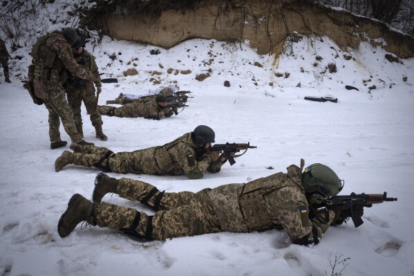 Members of the pro-Ukrainian Russian ethnic Siberian battalion practice at a military training ground near Kiev, Ukraine, Wednesday, Dec. 13, 2023.  Ukraine's army has created a battalion of soldiers composed entirely of Russian citizens who want to fight against Russian aggression.(AP Photo/Efrem Lukatsky)