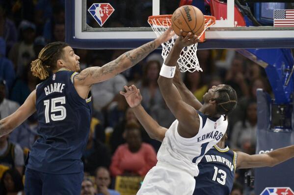 Minnesota Timberwolves forward Anthony Edwards (1) shoots against Memphis Grizzlies forward Brandon Clarke (15) in the first half during Game 5 of a first-round NBA basketball playoff series Tuesday, April 26, 2022, in Memphis, Tenn. (AP Photo/Brandon Dill)