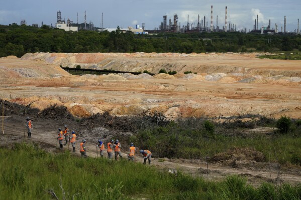 Employees work at a BYD vehicle factory under construction in Camacari, Bahia state, Brazil, Thursday, March 6, 2025. (AP Photo/Eraldo Peres)