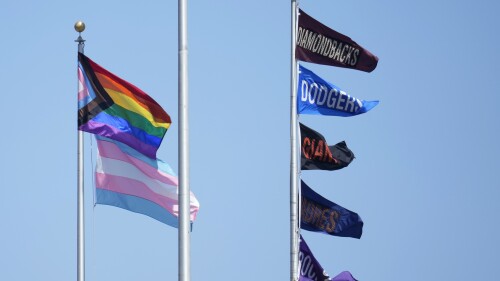 Flags representing LGBTQIA+ &amp; Transgender Pride fly next to national league west flags at Oracle Park during a baseball game between the San Francisco Giants and the Baltimore Orioles in San Francisco, Sunday, June 4, 2023. (AP Photo/Jeff Chiu)