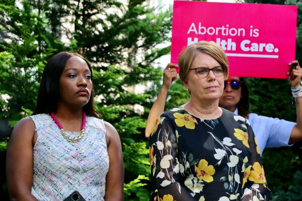 FILE - Democratic State Sen. Natalie Murdock, of Durham County, and state Rep. Julie von Haefen, of Wake County, encourage North Carolina voters to support candidates who will preserve abortion access at a news conference in Raleigh on Aug. 18, 2022. Planned Parenthood's political arm announced Thursday, Oct. 6, 2022 a $5 million investment in battleground North Carolina's state and national races as Democrats fight to preserve the governor's veto power and abortion access. (AP Photo/Hannah Schoenbaum, file)