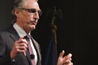 In this Tuesday, Jan. 23, 2018, photo, North Dakota Gov. Doug Burgum delivers his State of the State address at Minot University in Minot, N.D. Burgum announced Friday that he has pardoned 16 people convicted of low-level marijuana crimes, the first wave in what may be thousands under a new policy the first-term Republican said gives former offenders a second chance. (Kim Fundingsland/Minot Daily News via AP, File)