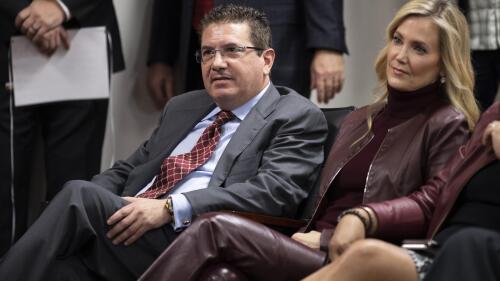 FILE - Washington Redskins owner Dan Snyder, left, and his wife Tanya Snyder, listen to head coach Ron Rivera during a news conference at the team's NFL football training facility in Ashburn, Va., Thursday, Jan. 2, 2020. A group led by Josh Harris and Mitchell Rales that includes Magic Johnson has an agreement in principle to buy the NFL's Washington Commanders from longtime owner Dan Snyder for a North American professional sports team record $6 billion, according to a person with knowledge of the situation. The person spoke to The Associated Press on condition of anonymity Thursday, April 13, 2023, because the deal had not been announced. (AP Photo/Alex Brandon, File)
