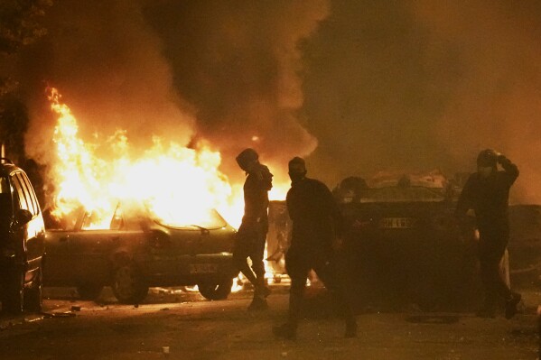 Youths clash with police forces as cars burn in Nanterre, outside Paris, Thursday, June 29, 2023. French President Emmanuel Macron has described the killing of a 17-year-old delivery driver by police at a traffic check 