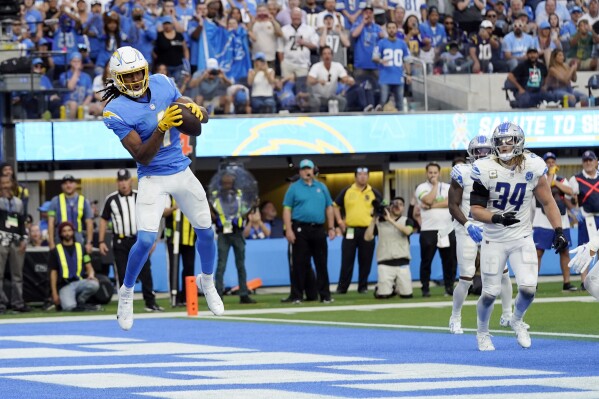 Los Angeles Chargers wide receiver Quentin Johnston (1) makes a touchdown catch during the second half an NFL football game against the Detroit Lions Sunday, Nov. 12, 2023, in Inglewood, Calif. (AP Photo/Gregory Bull)