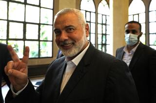 FILE - In this June 28, 2021 file photo, Ismail Haniyeh, the leader of the Palestinian militant group Hamas, flashes the victory sign after his meeting with Lebanese Parliament Speaker Nabih Berri, in Beirut, Lebanon. Hamas on Sunday, Aug. 1, 2021, said it has re-elected Haniyeh as its supreme leader. Haniyeh, who has been living in exile for the past two years, was given a new four-year term by the Shura Council, the Islamic group's top decision-making body. He was unopposed. (AP Photo/Hassan Ammar, File)