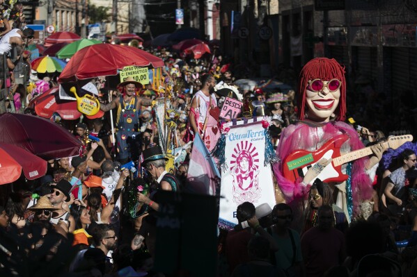 Revelers attend the "Ceu na Terra" or "Heaven on Earth" Carnival street party in Rio de Janeiro, Saturday, March 1, 2025. (AP Photo/Bruna Prado)