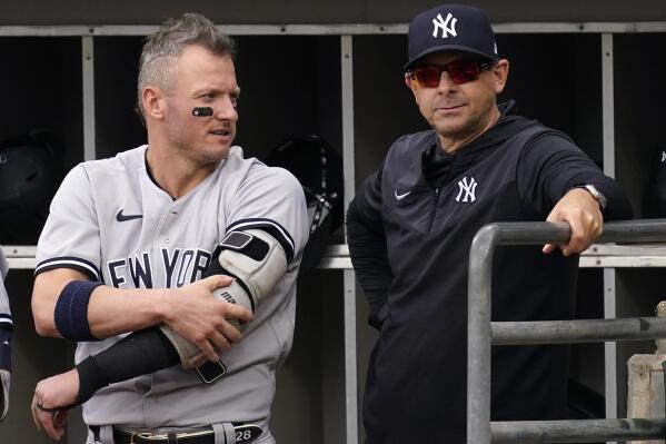 New York Yankees' Josh Donaldson, left, talks with manager Aaron Boone in the dugout during the first inning of a baseball game against the Chicago White Sox in Chicago, Sunday, May 15, 2022. (AP Photo/Nam Y. Huh)