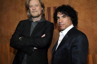 FILE - In this May 20, 2008 file photo, Daryl Hall, left, and John Oates, recipients of BMI Icons awards, pose together before the 56th annual BMI Pop Awards in Beverly Hills, Calif. The pop music duo has sued Brooklyn, N.Y. based Early Bird Foods in federal court. The suit asks the court to order Early Bird Foods to stop using the Haulin' Oats name on packages of granola. They’re accusing the company of violating trademark protections with its "phonetic play on Daryl Hall and John Oates' well-known brand name." (AP Photo/Chris Pizzello, File)