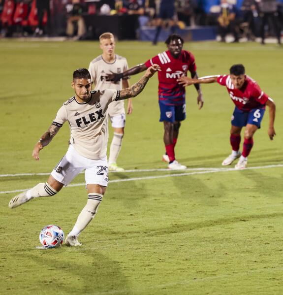 Los Angeles FC forward Cristian Arango (29) scores on a penalty kick against FC Dallas during the first half of an MLS soccer match Wednesday, Oct. 20, 2021, in Frisco, Texas. (Juan Figueroa/The Dallas Morning News via AP)