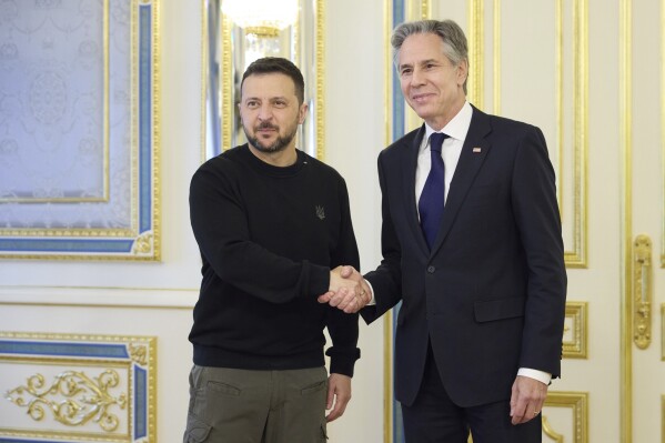 In this photo provided by the Ukrainian Presidential Press Office, Ukraine's President Volodymyr Zelenskyy, left, greets U.S. Secretary of State Antony Blinken, right, prior to their meeting in Kyiv, Ukraine, Tuesday, May 14, 2024. Blinken arrived in Kyiv on Tuesday in an unannounced diplomatic mission to reassure Ukraine that it has American support as it struggles to defend against increasingly intense Russian attacks. (Ukrainian Presidential Press Office via Ǻ)