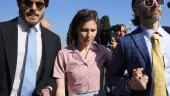 Amanda Knox arrives flanked by her husband Christopher Robinson, right, at the Florence courtroom in Florence, Italy, Wednesday, June 5, 2024. Amanda Knox returns to an Italian courtroom Wednesday for the first time in more than 12½ years to clear herself "once and for all" of a slander charge that stuck even after she was exonerated in the brutal 2007 murder of her British roommate in the idyllic hilltop town of Perugia. (AP Photo/Antonio Calanni)