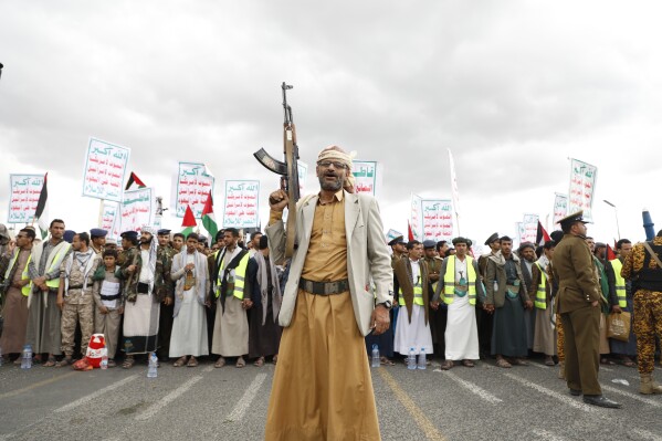 FILE - Houthi supporters attend a rally against the U.S.-led airstrikes on Yemen and in support of the Palestinians in the Gaza Strip on Yemen, in Sanaa, Yemen, Friday, Feb. 09, 2024. Despite a month of U.S.-led airstrikes, Yemen's Iranian-backed Houthi rebels have launched attacks seriously damaging a ship in the crucial Bab el-Mandeb Strait and apparently bringing down an American drone worth tens of millions of dollars. (AP Photo/Osamah Abdulrahman, File)