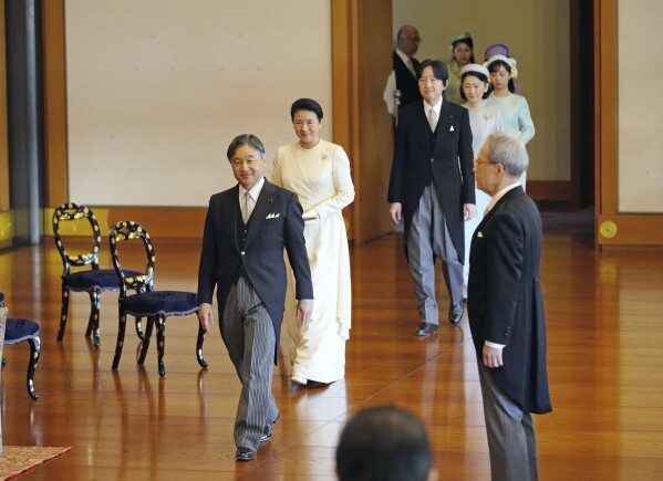 Japan's Emperor Naruhito, from left, Empress Masako, Crown Prince Akishino, Crown Princess Kiko and their daughter Princess Kako arrive at an annual celebration of poetry at the Imperial Palace in Tokyo, Friday, Jan. 19, 2024. Masako expressed her yearning for peace as a mother’s love in her poem Friday at an annual celebration of poetry at the Imperial Palace in Tokyo. (Yohei Fukai/Kyodo News via AP)