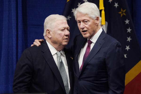 Former President Bill Clinton, right, confers with former Republican Mississippi Gov. Haley Barbour after speaking at the long-delayed memorial service for former Mississippi Gov. William Winter, who died in 2020, and his wife Elise Winter, who died in 2021, Tuesday, May 3, 2022, at the Two Mississippi Museums in Jackson, Miss. (AP Photo/Rogelio V. Solis)