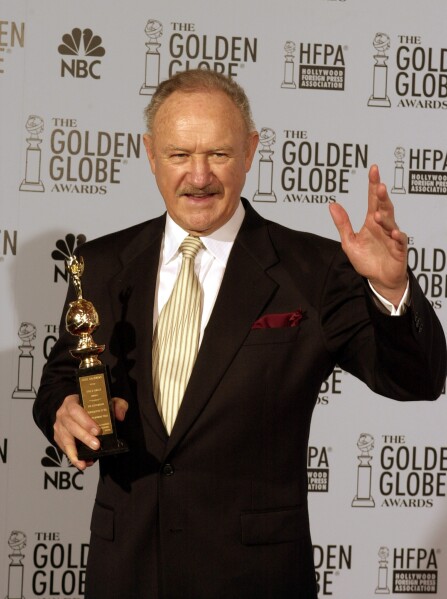 Gene Hackman holds his Cecil B. DeMille award at the 60th annual Golden Globe Awards in Beverly Hills, Calif. Sunday, Jan. 19, 2003. (AP Photo/Reed Saxon, File)