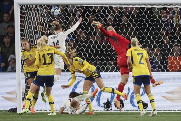Sweden's goalkeeper Zecira Musovic, top right, saves a ball during the Women's World Cup round of 16 soccer match between Sweden and the United States in Melbourne, Australia, Sunday, Aug. 6, 2023. (AP Photo/Hamish Blair)