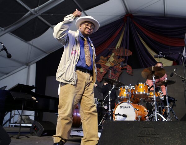 CORRECTS MAYOR'S LAST NAME TO CANTRELL INSTEAD OF CAMPBELL - FILE - In this May 5, 2013, file photo, jazz pianist Ellis Marsalis, father of musicians Wynton Marsalis, Branford Marsalis, Delfeao Marsalis and Jason Marsalis, acknowledges the crowd after performing at the New Orleans Jazz and Heritage Festival in New Orleans. New Orleans Mayor LaToya Cantrell announced Wednesday, April 1, 2020, that Marsalis has died. He was 85. (AP Photo/Gerald Herbert, File)
