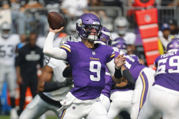 Minnesota Vikings quarterback J.J. McCarthy (9) throws against the Las Vegas Raiders during the first half of an NFL football game Saturday, Aug. 10, 2024, in Minneapolis. (AP Photo/Bruce Kluckhohn)