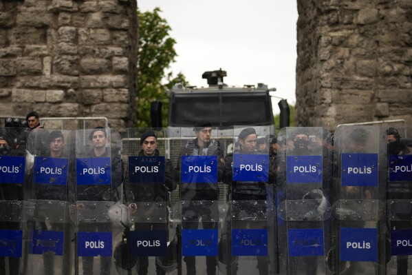 Riot police officers stand guard and block the road to protesters as union  march during Labor Day celebrations in Istanbul, Turkey, Wednesday, May 1, 2024. Police in Istanbul detained dozens of people who tried to reach the city's main square, Taksim, in defiance of a government ban on... Celebrate Labor Day on May 1st at the historic site.  (AP Photo/Emrah Gurel)