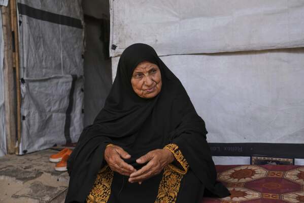 Ghalia Abu Moteir, whose family fled what is now Israel during the 1948 war that surrounded its creation, shelters from the current war in a tent in Khan Younis, Gaza Strip, after being displaced from her home in Rafah, Wednesday, May 14, 2025. (AP Photo/Abdel Kareem Hana)