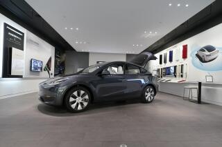 FILE - A Tesla Model Y Long Range is displayed on Feb. 24, 2021, at the Tesla Gallery in Troy, Mich. Tesla is recalling nearly 27,000 vehicles in the U.S. because the cabin heating systems may not defrost the windshield quickly enough. The latest in a series of recent recalls covers certain 2021 and 2022 Models 3, S, and X, and some 2020 through 2022 Model Y vehicles. (AP Photo/Carlos Osorio, File)