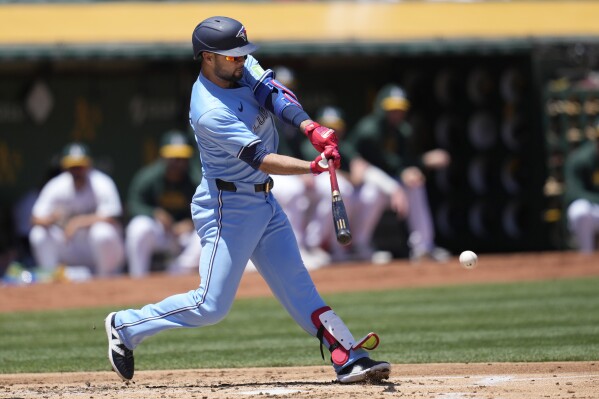 Toronto Blue Jays' Isiah Kiner-Falefa hits a two-run single against the Oakland Athletics during the second inning of a baseball game in Oakland, Calif., Sunday, June 9, 2024. (AP Photo/Jeff Chiu)