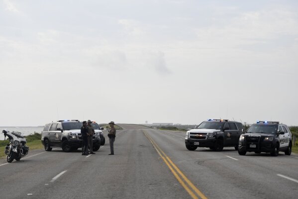 The entrances to the Naval Air Station-Corpus Christi are closed following an active shooter threat, Thursday, May 21, 2020, in Corpus Christi, Texas. Naval Air Station-Corpus Christi says the shooter was "neutralized" and the facility is on lockdown.  (Annie Rice/Corpus Christi Caller-Times via AP)